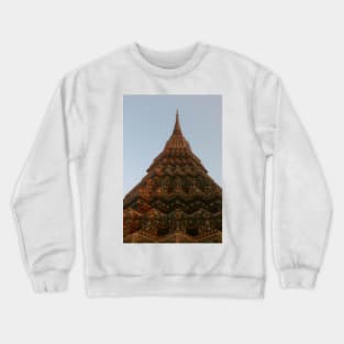 First low angle view of a Buddha stupa reaching symmetrical in the clear sky. Crewneck Sweatshirt